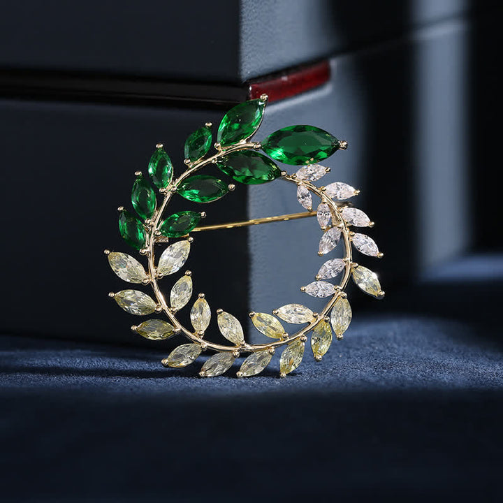 Broche de hojas de trigo doradas y circonitas para mujer
