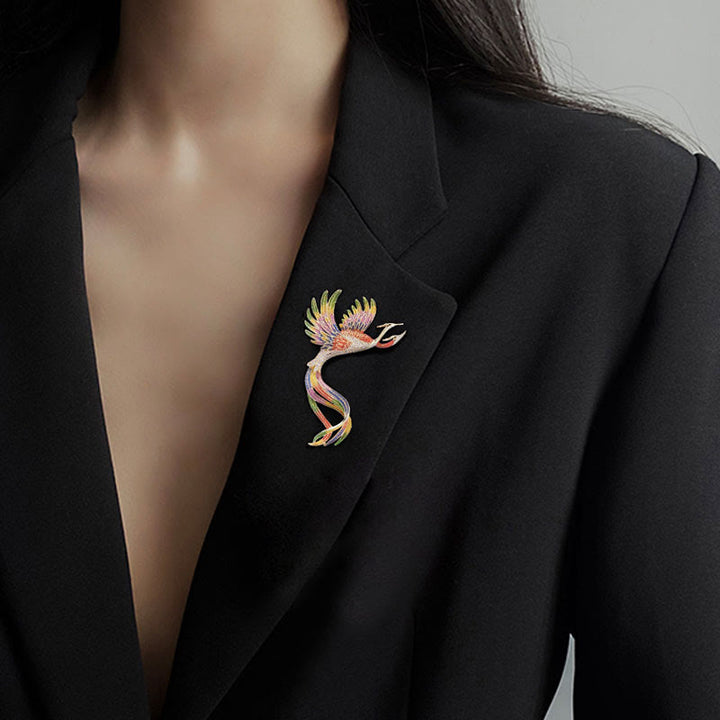 Broche de mujer con fénix de dos cabezas en vuelo