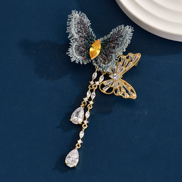 Broche elegante con borlas de mariposa azul para mujer