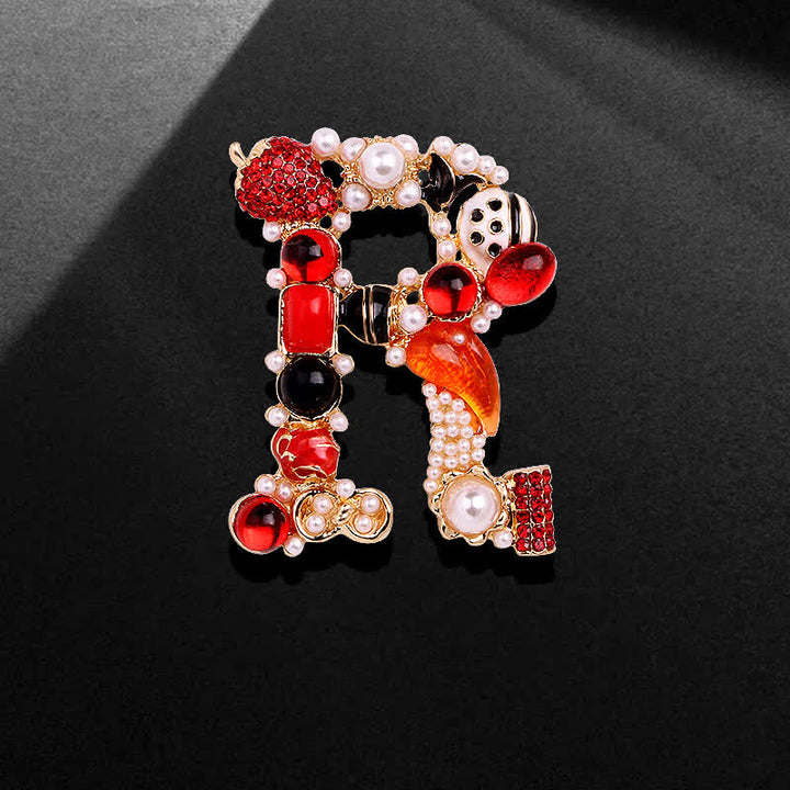 Broche unisex con letra de perla barroca