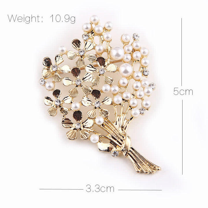 Broche de mujer con ramo de perlas y flores doradas