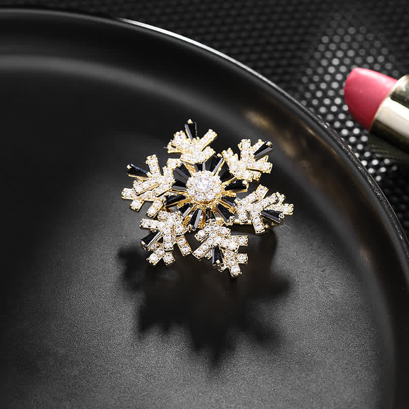 Broche de copo de nieve giratorio para mujer
