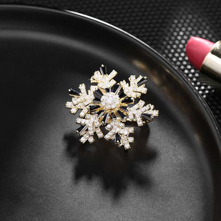 Broche de copo de nieve giratorio para mujer