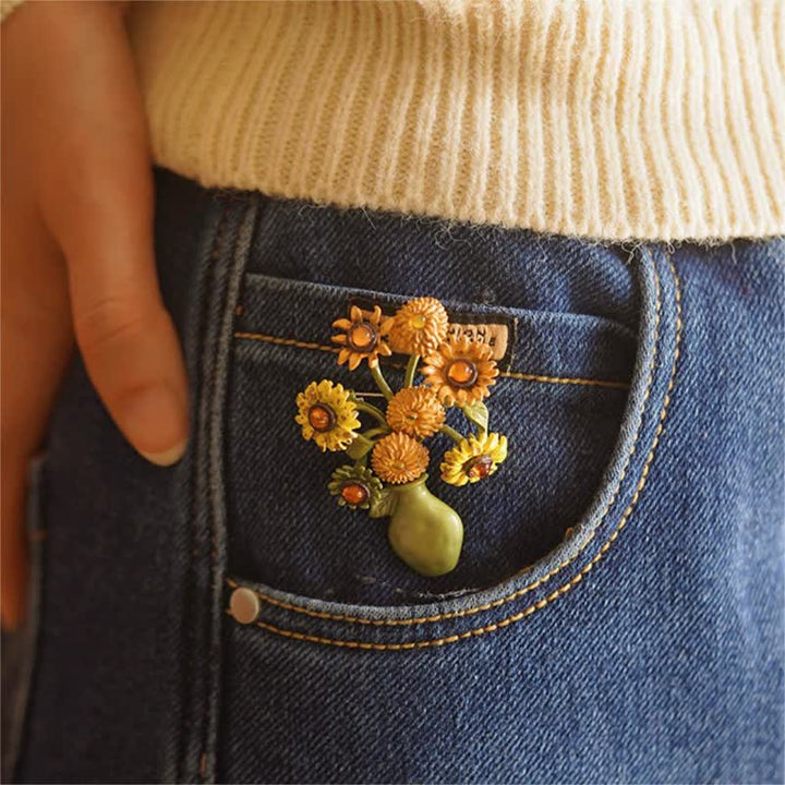 Broche de mujer con forma de girasol esmaltado