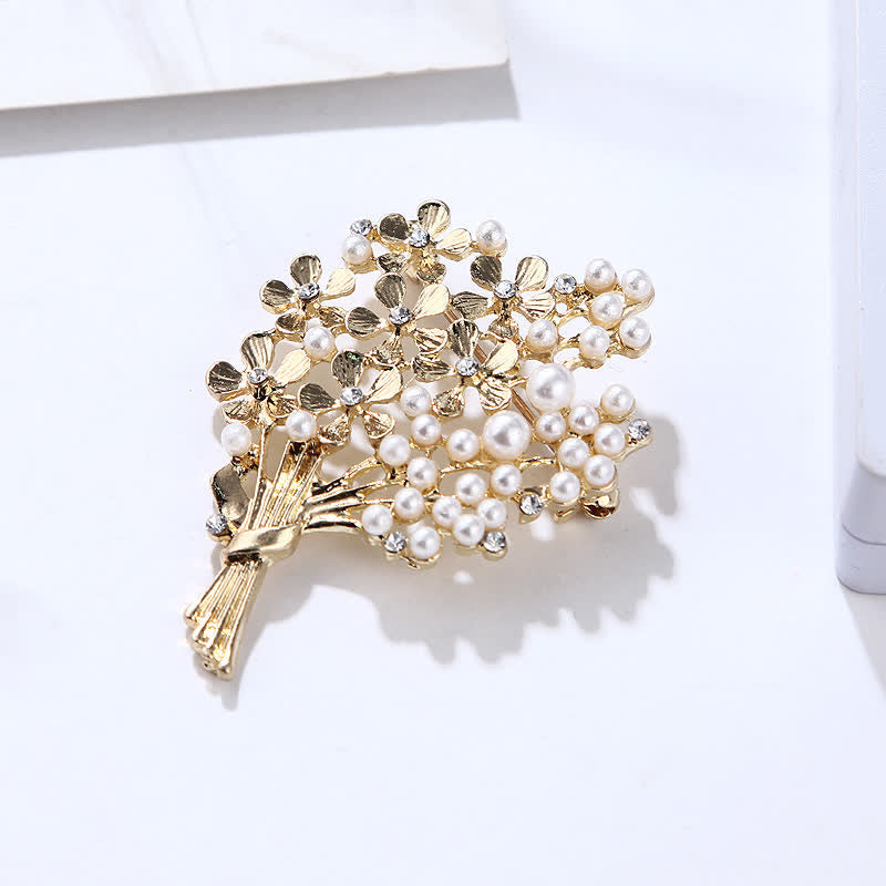 Broche de mujer con ramo de perlas y flores doradas