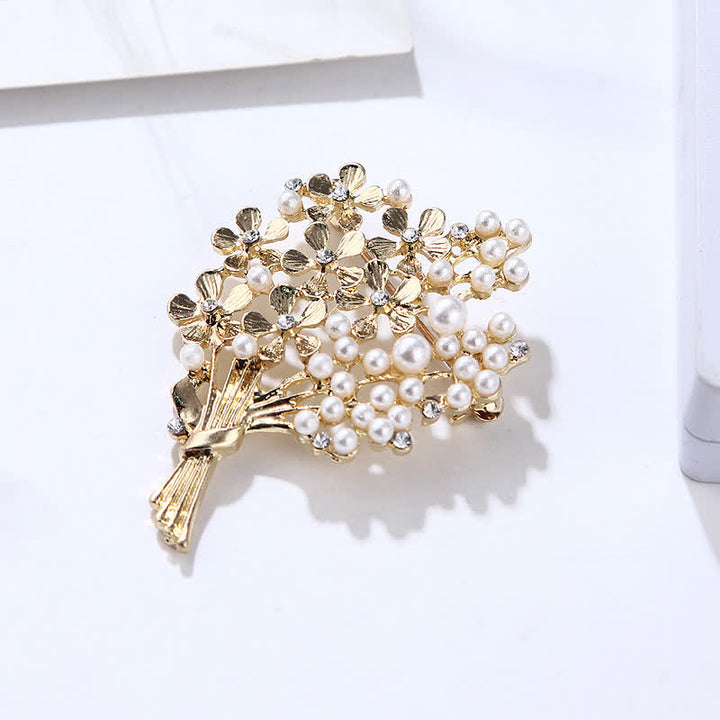 Broche de mujer con ramo de perlas y flores doradas