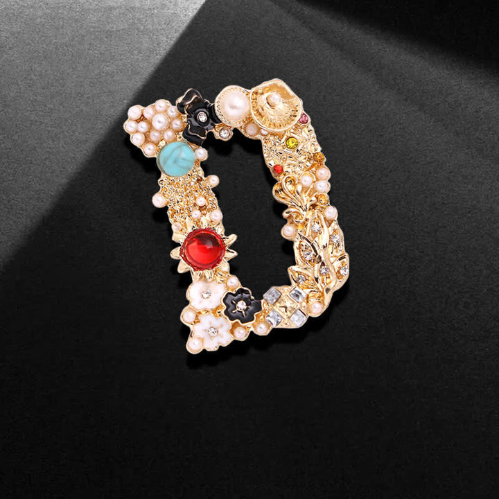 Broche unisex con letra de perla barroca
