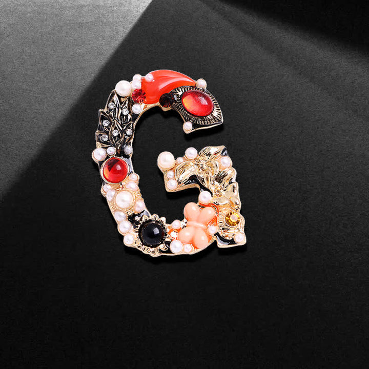 Broche unisex con letra de perla barroca