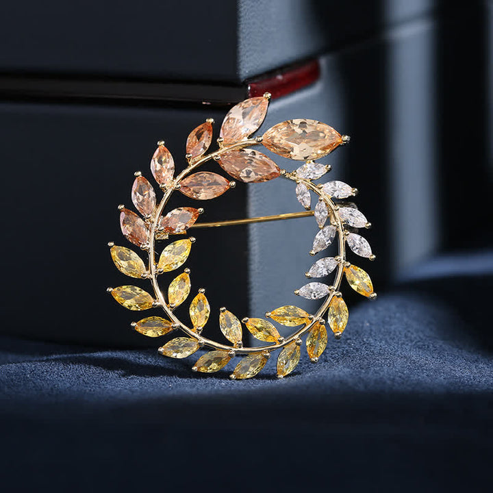 Broche de hojas de trigo doradas y circonitas para mujer