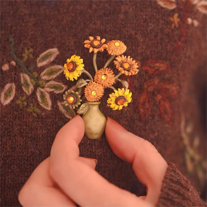 Broche de mujer con forma de girasol esmaltado