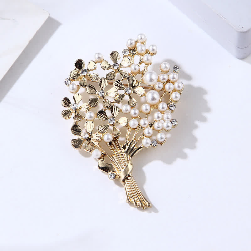 Broche de mujer con ramo de perlas y flores doradas