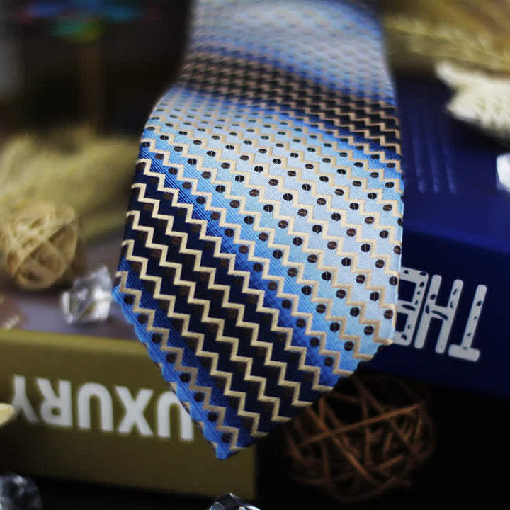 Corbata de hombre con rayas en zigzag y lunares en azul degradado y negro