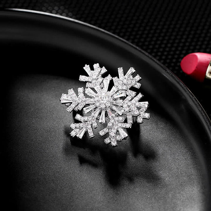 Broche de copo de nieve giratorio para mujer