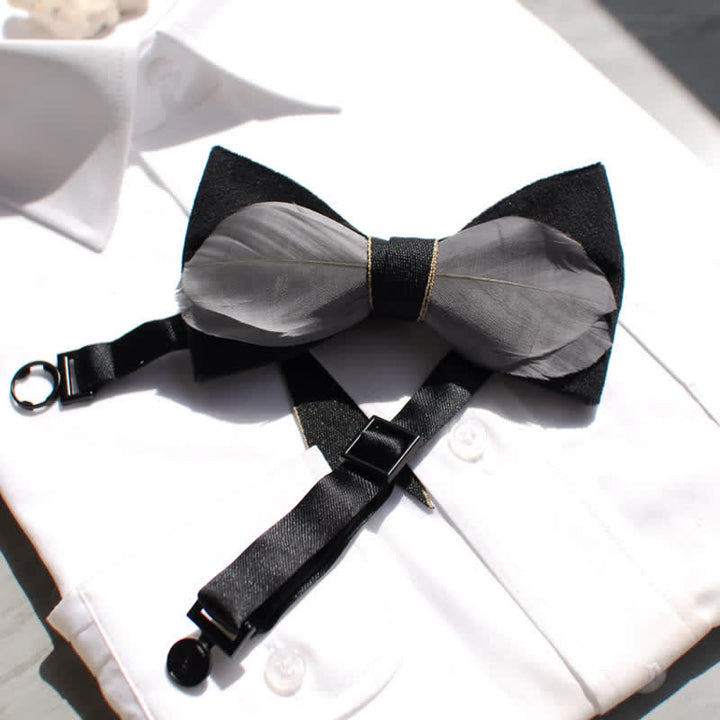 Pajarita de terciopelo gris y negro con plumas