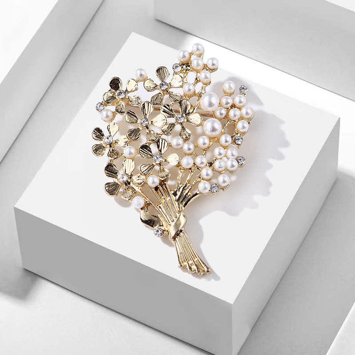 Broche de mujer con ramo de perlas y flores doradas