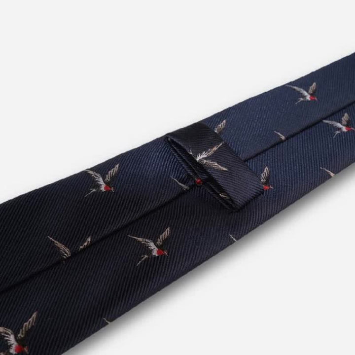 Corbata tejida con golondrinas bordadas en azul marino para hombre