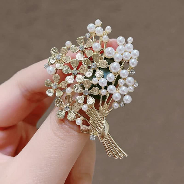 Broche de mujer con ramo de perlas y flores doradas
