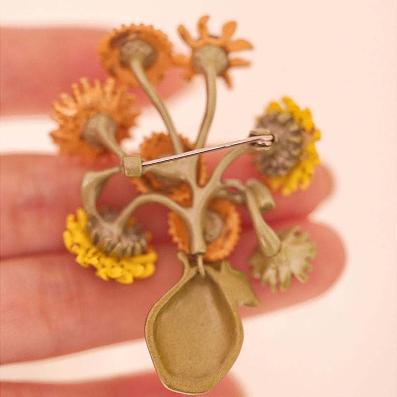 Broche de mujer con forma de girasol esmaltado