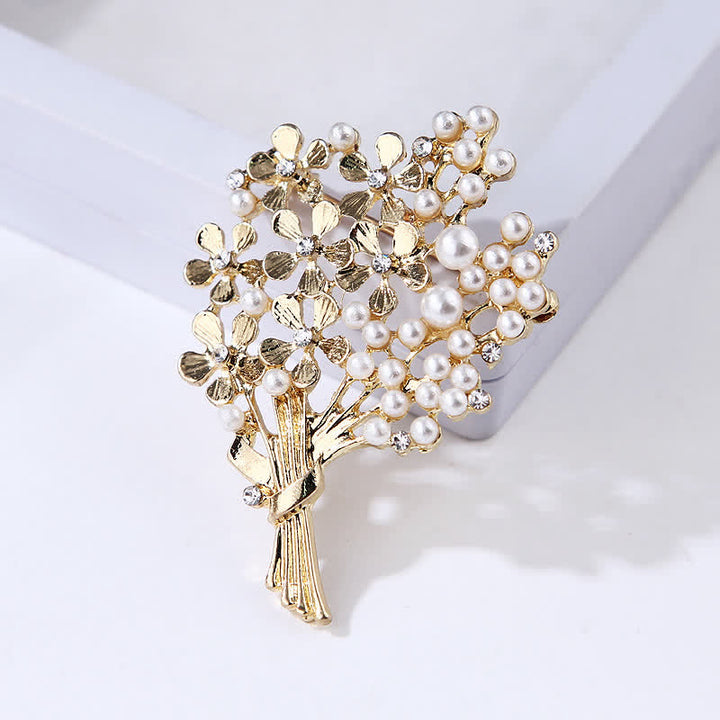 Broche de mujer con ramo de perlas y flores doradas