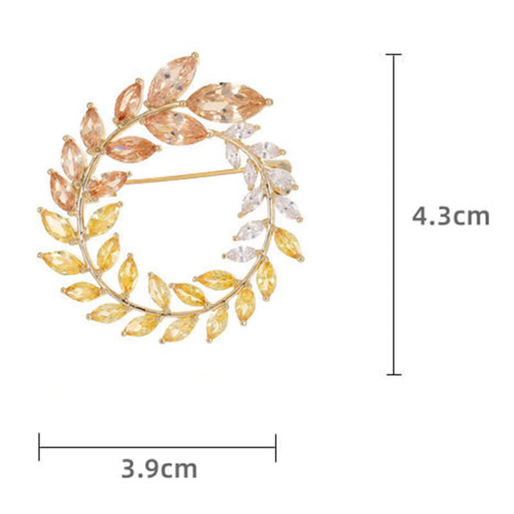 Broche de hojas de trigo doradas y circonitas para mujer