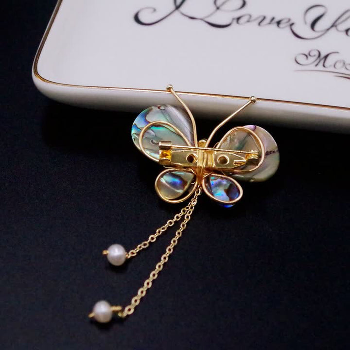 Broche de borla con forma de mariposa y concha para mujer