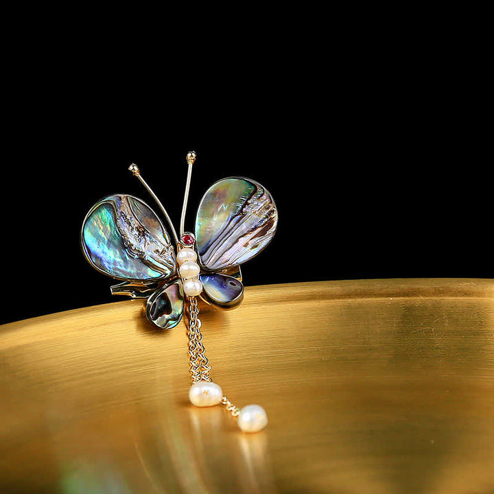 Broche de borla con forma de mariposa y concha para mujer