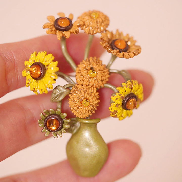 Broche de mujer con forma de girasol esmaltado