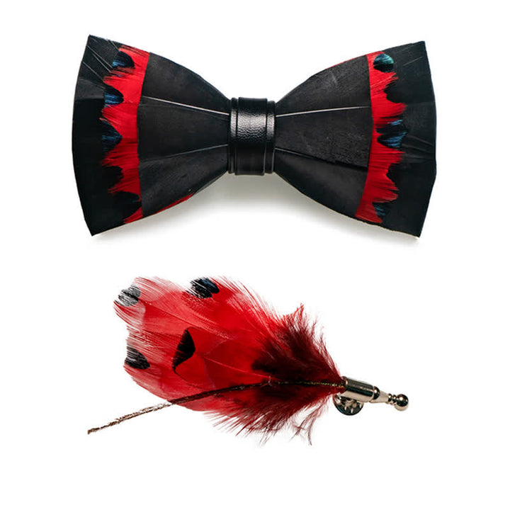 Pajarita infantil con plumas de cisne negras y rojas y broche de solapa
