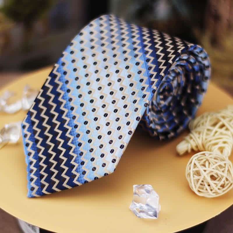 Corbata de hombre con rayas en zigzag y lunares en azul degradado y negro